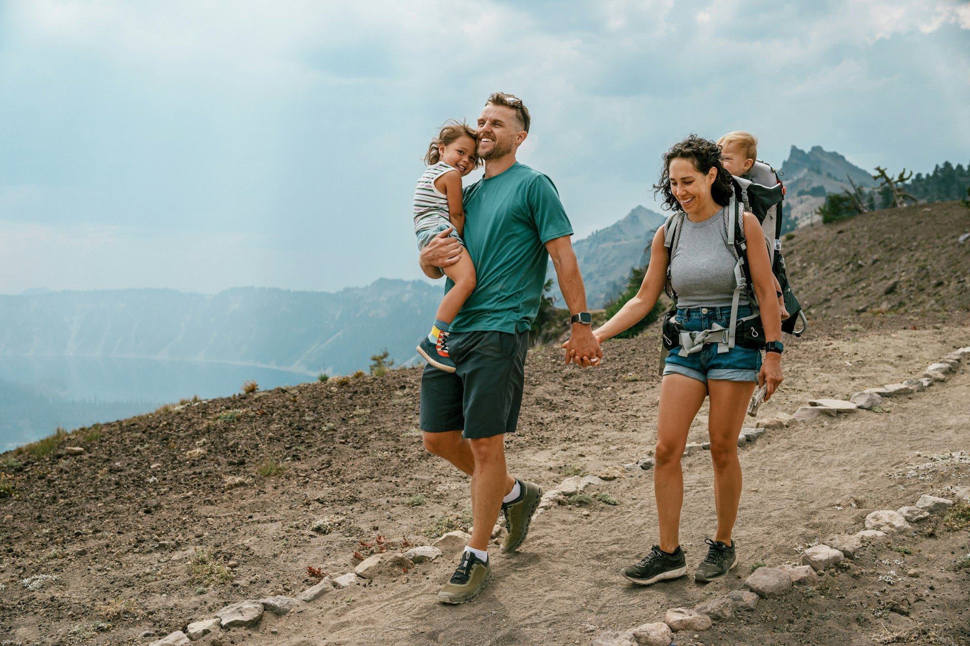 A family hiking a mountain trail together